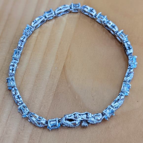 Blue Topaz and Diamond Accent Infinity Bracelet - Picture 8 of 9